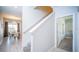 Interior view of carpeted staircase and dining area at 8919 Stinger Dr, Davenport, FL 33896