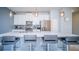 Modern kitchen with island and stainless steel appliances at 8919 Stinger Dr, Davenport, FL 33896