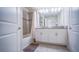 Bathroom with double vanity and tub at 8919 Stinger Dr, Davenport, FL 33896