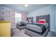 Bedroom with twin beds and Mickey Mouse wallpaper at 8919 Stinger Dr, Davenport, FL 33896