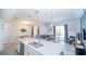 Open concept kitchen with island and breakfast bar at 8919 Stinger Dr, Davenport, FL 33896