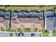 Aerial view of community with townhouses and pools at 8919 Stinger Dr, Davenport, FL 33896