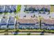 Aerial view of townhomes with private pools and lush landscaping at 8919 Stinger Dr, Davenport, FL 33896