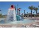 Community water park with a water playground, slides and lounge chairs at 8919 Stinger Dr, Davenport, FL 33896