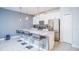Modern kitchen with island and stainless steel appliances at 8919 Stinger Dr, Davenport, FL 33896