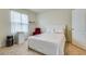 Cozy bedroom with a queen-size bed and a relaxing armchair at 320 Boardwalk Ave, Haines City, FL 33844