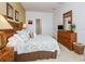Large bedroom with a king-size bed, dresser, and nightstands at 573 Viola Dr, Davenport, FL 33837