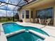 Screened pool and spa with patio furniture at 573 Viola Dr, Davenport, FL 33837