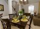 Formal dining room with a table set for six and ample space at 573 Viola Dr, Davenport, FL 33837