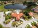 Community overview featuring pool, clubhouse and lake at 573 Viola Dr, Davenport, FL 33837