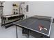 Game room with air hockey and ping pong table at 573 Viola Dr, Davenport, FL 33837
