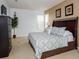 Spacious main bedroom with king-size bed and large dresser at 573 Viola Dr, Davenport, FL 33837