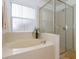 Relaxing bathroom with large garden tub and separate shower at 573 Viola Dr, Davenport, FL 33837