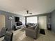 Living room featuring a sectional sofa and built-in electric fireplace at 1536 Espanola Ave, Holly Hill, FL 32117