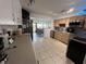 Bright kitchen with stainless steel appliances and wood cabinets at 1536 Espanola Ave, Holly Hill, FL 32117