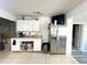 Simple kitchen with stainless steel refrigerator at 1536 Espanola Ave, Holly Hill, FL 32117
