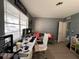 Bright home office with ample workspace and a comfortable seating area at 1536 Espanola Ave, Holly Hill, FL 32117