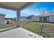 Covered patio overlooking a spacious backyard at 4248 Sawtooth Ct, Tavares, FL 32778