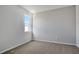 Well-lit bedroom featuring neutral walls and carpeting at 4248 Sawtooth Ct, Tavares, FL 32778