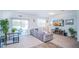 Living room with gray sectional sofa and sliding glass doors at 350 Madison Dr, Davenport, FL 33837