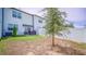 Backyard features a patio, grassy area, and a privacy fence, ideal for outdoor enjoyment at 350 Madison Dr, Davenport, FL 33837
