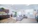 Open living room with gray sectional sofa and access to patio at 350 Madison Dr, Davenport, FL 33837