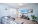 Living room with gray sectional sofa and large TV at 350 Madison Dr, Davenport, FL 33837