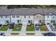 Aerial view of a row of townhomes, offering a perspective on the community layout and parking at 350 Madison Dr, Davenport, FL 33837