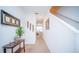 Bright hallway with carpeted floors and neutral walls, leading to other rooms at 350 Madison Dr, Davenport, FL 33837