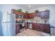 Modern kitchen with dark wood cabinets and granite countertops at 350 Madison Dr, Davenport, FL 33837