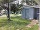 Backyard view of a house with a shed and AC unit at 101 Albert St, Winter Springs, FL 32708