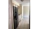 Kitchen features black refrigerator and light beige cabinets at 101 Albert St, Winter Springs, FL 32708