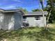 Gray house with a large backyard and a shed at 101 Albert St, Winter Springs, FL 32708
