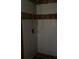 Shower stall with brown and white tile at 101 Albert St, Winter Springs, FL 32708