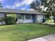 Ranch style home with well-manicured lawn and attached garage at 101 Albert St, Winter Springs, FL 32708