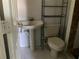 Simple bathroom with a toilet and pedestal sink at 101 Albert St, Winter Springs, FL 32708