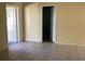 View of living area with tiled floor and access to other rooms at 101 Albert St, Winter Springs, FL 32708