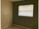 Simple bedroom featuring tiled floors and a window with blinds at 101 Albert St, Winter Springs, FL 32708