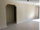 Living room with arched doorway and tile floor at 101 Albert St, Winter Springs, FL 32708