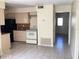 Kitchen with black refrigerator, white stove and beige cabinets at 101 Albert St, Winter Springs, FL 32708
