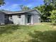 Gray house with a large backyard and sandbags at 101 Albert St, Winter Springs, FL 32708