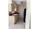 Kitchen features a white sink, beige cabinets, and a back door at 101 Albert St, Winter Springs, FL 32708