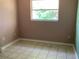 Spacious bedroom with tiled floors and a window at 101 Albert St, Winter Springs, FL 32708