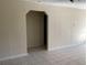 Living room with arched doorway and tile floor at 101 Albert St, Winter Springs, FL 32708