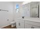 Clean bathroom, featuring white cabinets and a large mirror at 6333 Clover St, Lake Hamilton, FL 33851