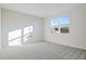 Spacious bedroom with neutral carpeting and large windows at 6333 Clover St, Lake Hamilton, FL 33851