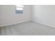 Bright bedroom with gray carpet and neutral walls at 6333 Clover St, Lake Hamilton, FL 33851
