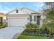 New construction home with two-car garage and landscaped front yard at 6333 Clover St, Lake Hamilton, FL 33851