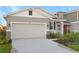 New construction home with two-car garage and landscaped front yard at 6333 Clover St, Lake Hamilton, FL 33851