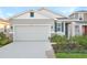 New construction home with two-car garage and landscaped front yard at 6333 Clover St, Lake Hamilton, FL 33851